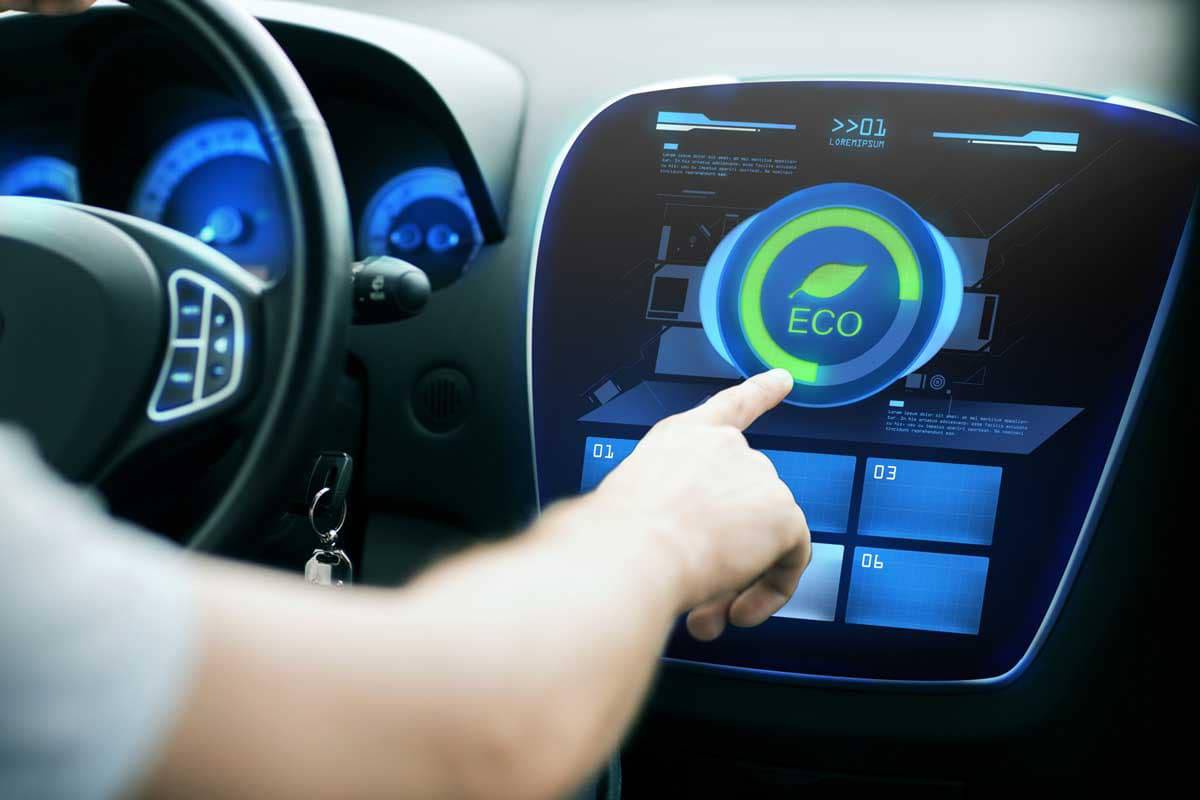 A hand pressing the  button on a futuristic car dashboard display, promoting eco-friendly driving mode.