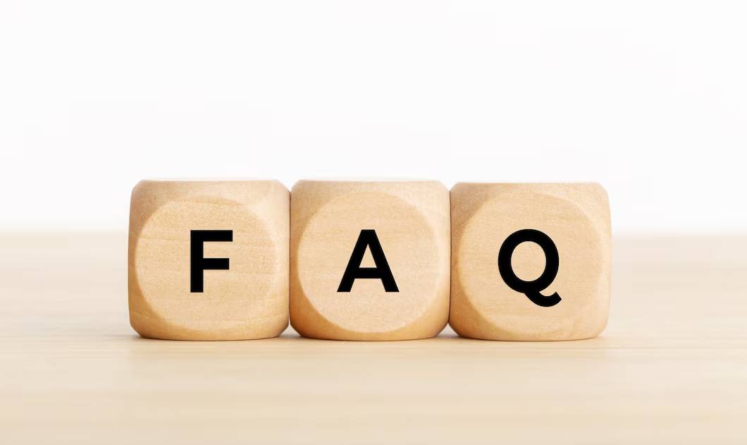 Three wooden blocks displaying the letters  representing the acronym for 